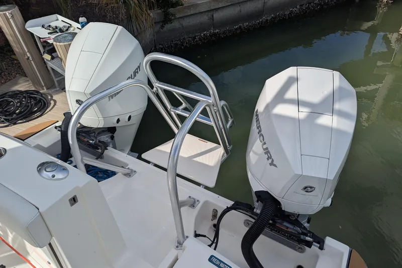 Slide: The Image of 2021 World Cat 280 DC-X boat with dual Mercury outboard engines at dock. - 17