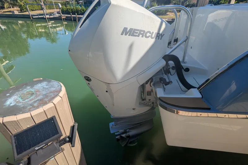 Slide: The Image of 2021 World Cat 280 DC-X boat with Mercury outboard engine at dock. - 18