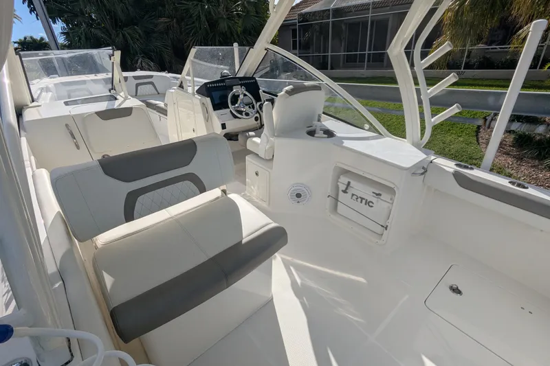 Slide: The Image of Interior of 2021 World Cat 280 DC-X boat with modern seating and steering console. - 6