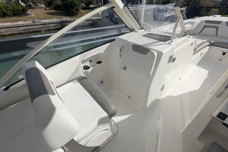 Slide: The Image of 2021 World Cat 280 DC-X boat interior with seating and helm station. - 7