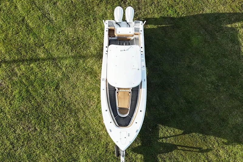 Slide: The Image of Overhead view of 2023 Seahunt 30 GameFish Coffin box boat on grass. - 10