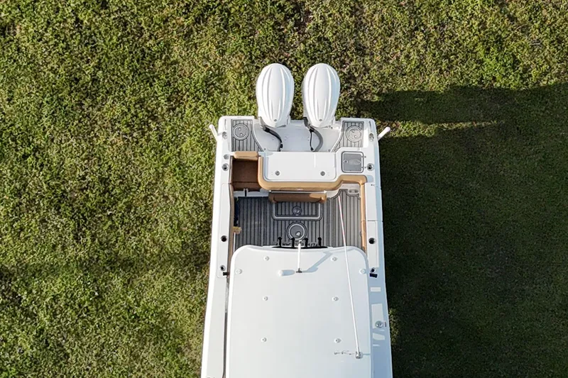 Slide: The Image of Aerial view of 2023 Seahunt 30 GameFish Coffin box boat on grass. - 11