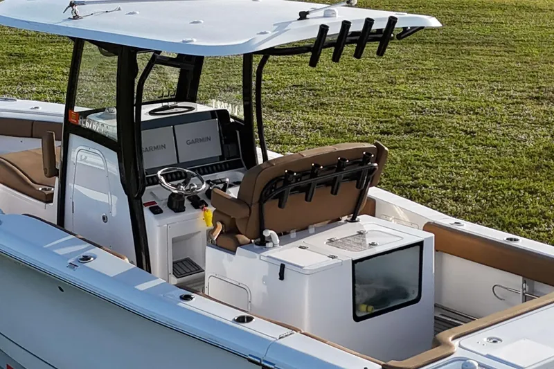 Slide: The Image of 2023 Seahunt 30 GameFish Coffin Box boat interior with Garmin electronics and seating. - 15