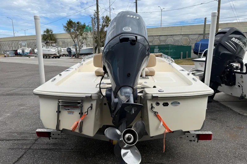 Slide: The Image of 2022 Scout 177 Sport boat with Yamaha outboard motor in a marina setting. - 2