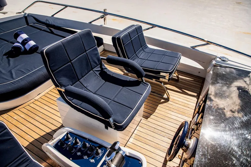 Slide: The Image of Luxury seating on 2012 Pershing Sport Boat Planning with teak deck and nautical decor. - 20