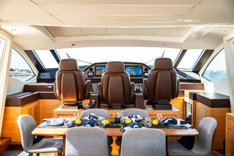 Slide: The Image of Luxurious interior of 2012 Pershing Sport Boat with elegant dining setup and modern cockpit. - 8