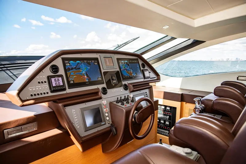 Slide: The Image of Luxurious 2012 Pershing Sport Boat Planning cockpit with advanced navigation systems. - 9