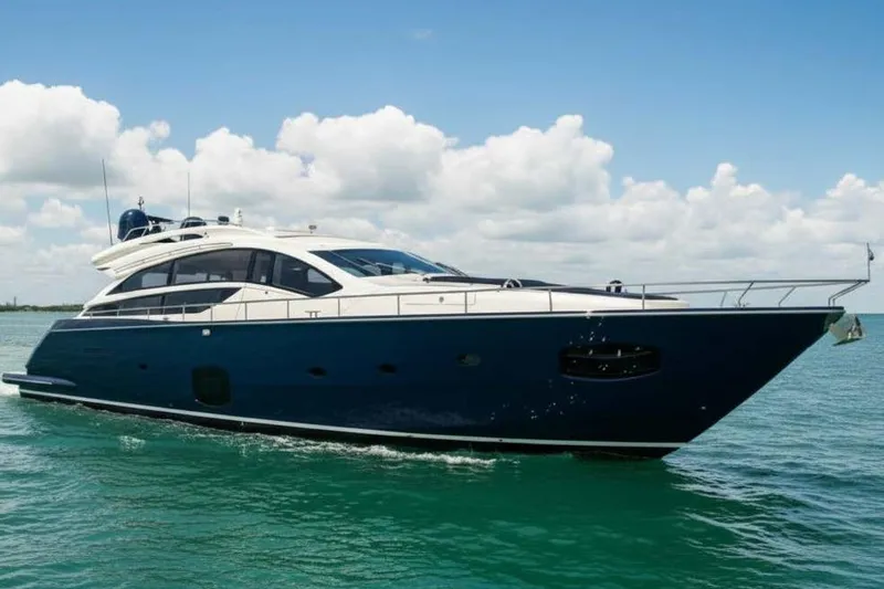 The Image of 2012 Pershing Sport Boat Planning on calm sea under blue sky. - 1