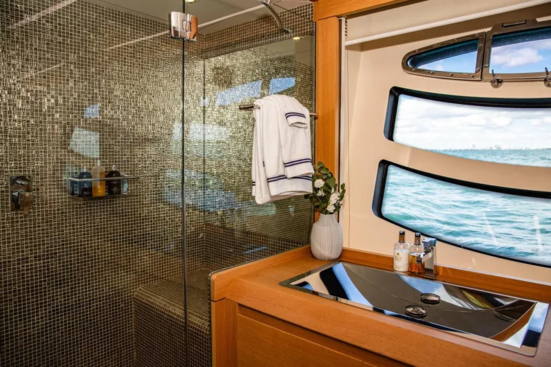 Slide: The Image of Luxurious bathroom interior of 2012 Pershing Sport Boat with ocean view window. - 13