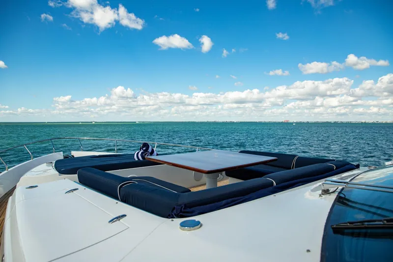 Slide: The Image of Luxurious 2012 Pershing Sport Boat with deck seating, ocean view, and blue sky. - 22