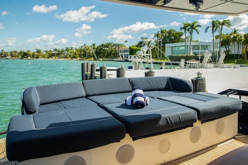 Slide: The Image of Luxurious 2012 Pershing Sport Boat with sunbed, docked by tropical waterfront. - 4