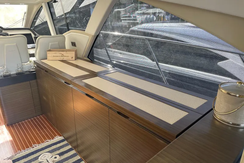Slide: The Image of Luxurious interior of 2015 Azimut 55S yacht with elegant wood cabinetry and seating. - 10