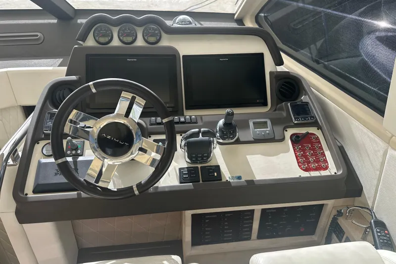 Slide: The Image of Cockpit of 2015 Azimut 55S yacht with steering wheel and control panels. - 14
