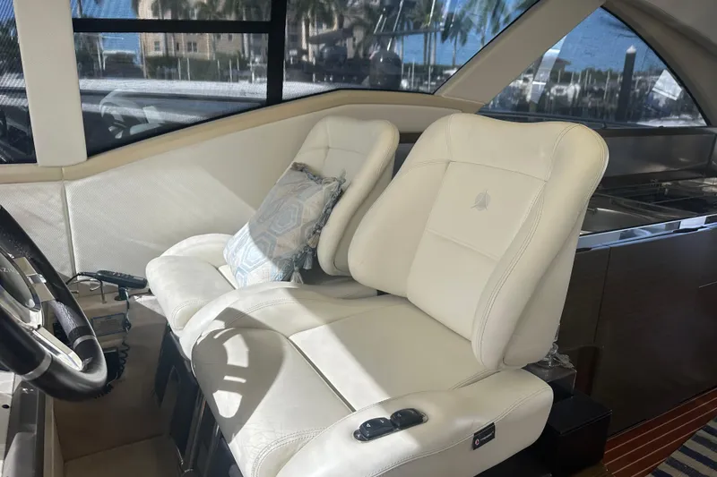 Slide: The Image of Interior of a 2015 Azimut 55S yacht with luxurious white seating. - 15