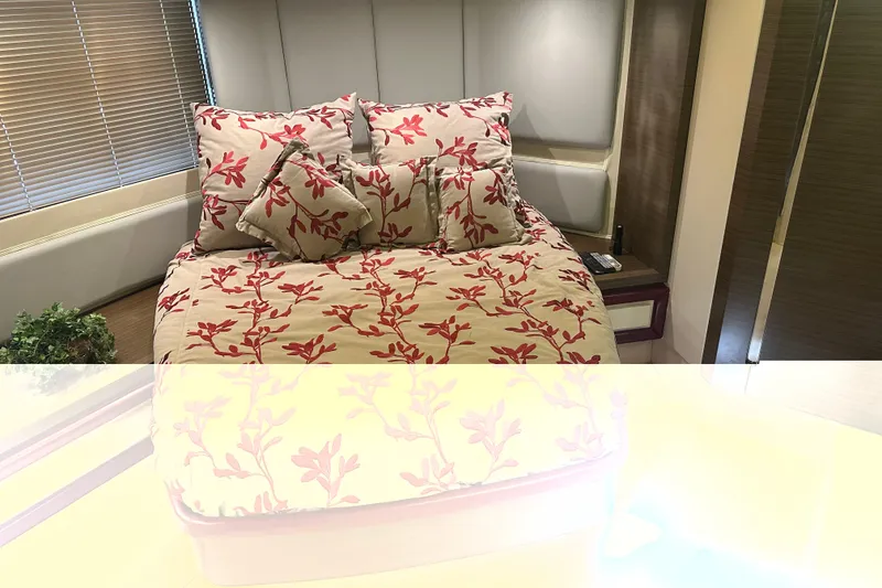 Slide: The Image of Luxurious bedroom interior of 2015 Azimut 55S yacht with floral bedding and modern decor. - 16