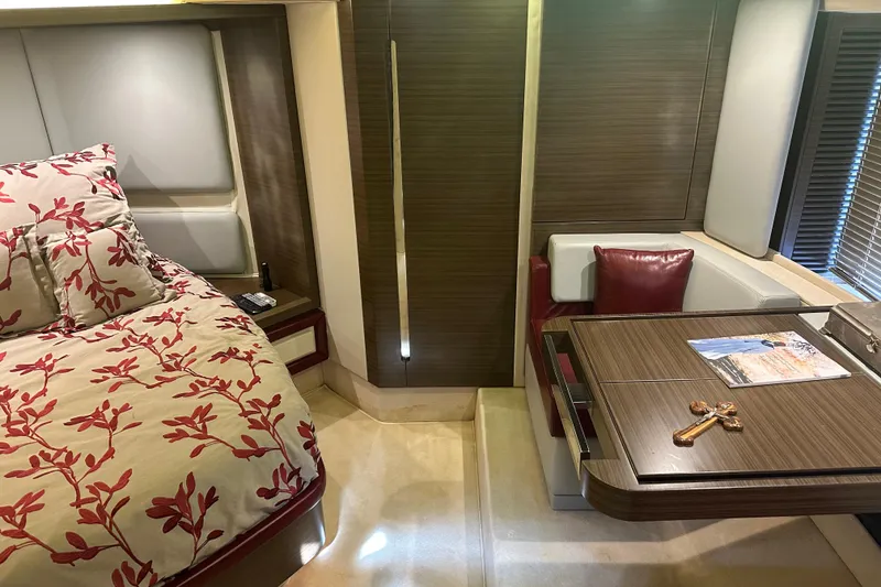 Slide: The Image of Luxurious interior of a 2015 Azimut 55S yacht with elegant bedding and wooden table. - 17