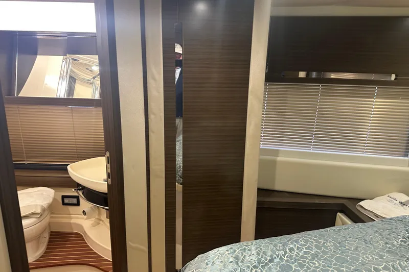 Slide: The Image of Interior of 2015 Azimut 55S yacht featuring bathroom and bedroom with modern design. - 26