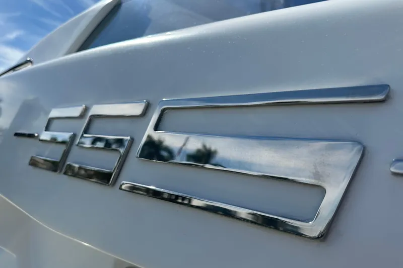 Slide: The Image of Close-up of 2015 Azimut 55S yacht emblem with reflective chrome finish. - 34
