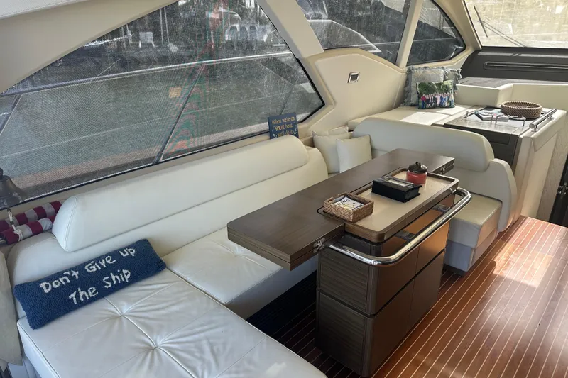 Slide: The Image of Luxurious interior of 2015 Azimut 55S yacht with elegant seating and dining area. - 9