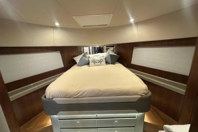 Slide: The Image of Luxurious bedroom interior of 2023 Belize 54 Day Bridge yacht, featuring elegant bedding and wood accents. - 21