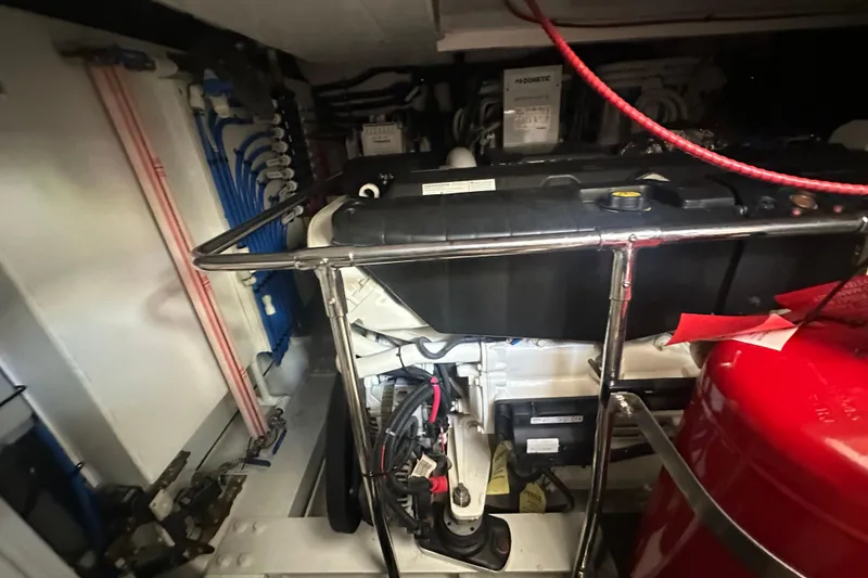 Slide: The Image of Engine room of 2023 Belize 54 Day Bridge yacht, showcasing mechanical components and wiring. - 33