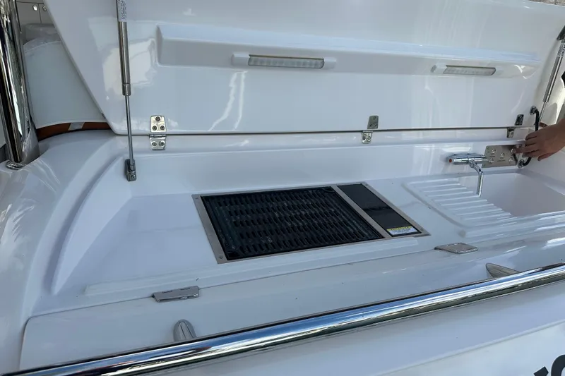 Slide: The Image of Outdoor kitchen setup on 2023 Belize 54 Day Bridge yacht, featuring grill and sink. - 6