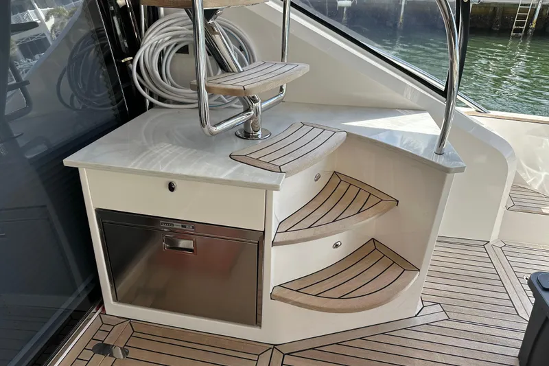 Slide: The Image of Luxury yacht interior with wooden steps and stainless steel accents, Belize 54 Day Bridge 2023. - 8