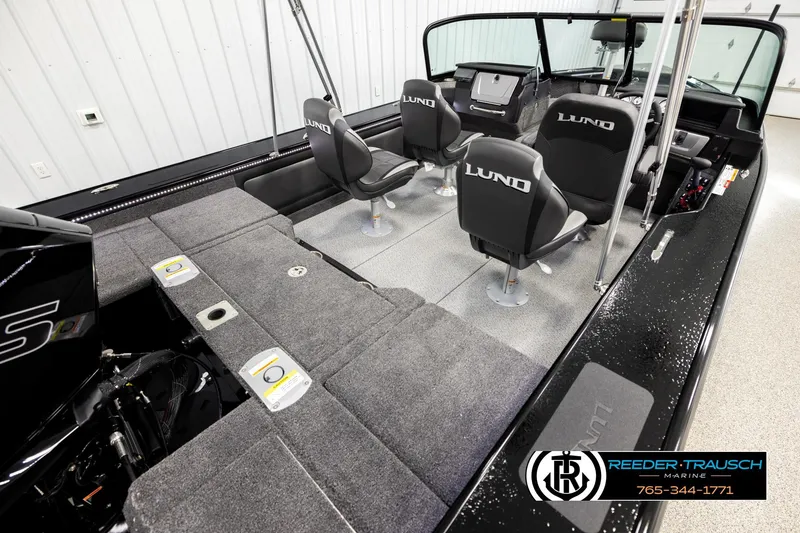 Slide: The Image of 2026 Lund 1975 Pro-V Sport boat interior with seating and storage compartments. - 11