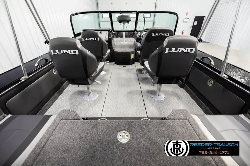 Slide: The Image of Interior of 2026 Lund 1975 Pro-V Sport boat with four seats and modern design. - 12