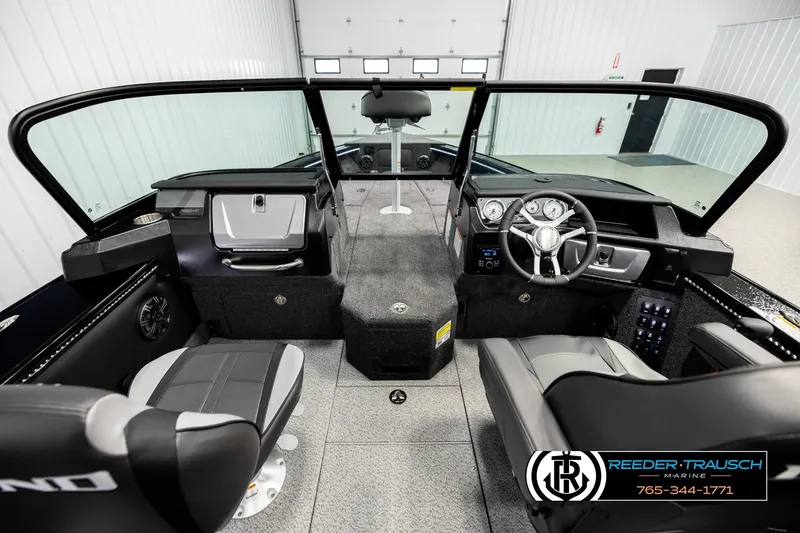 Slide: The Image of Interior of 2026 Lund 1975 Pro-V Sport boat with modern dashboard and seating. - 13