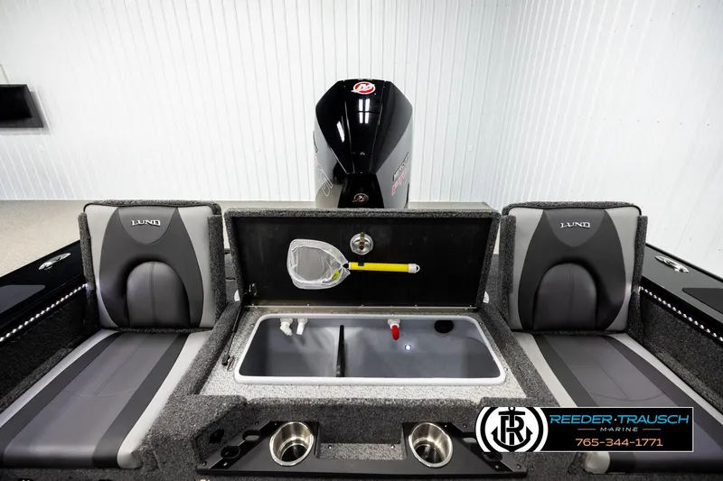 Slide: The Image of 2026 Lund 1975 Pro-V Sport boat interior with seating and storage compartments. - 18