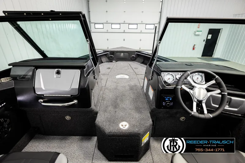 Slide: The Image of Interior view of 2026 Lund 1975 Pro-V Sport boat with modern dashboard and steering wheel. - 20