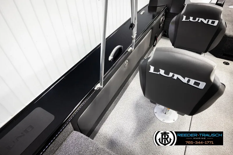 Slide: The Image of 2026 Lund 1975 Pro-V Sport boat interior with branded seats and sleek design. - 28
