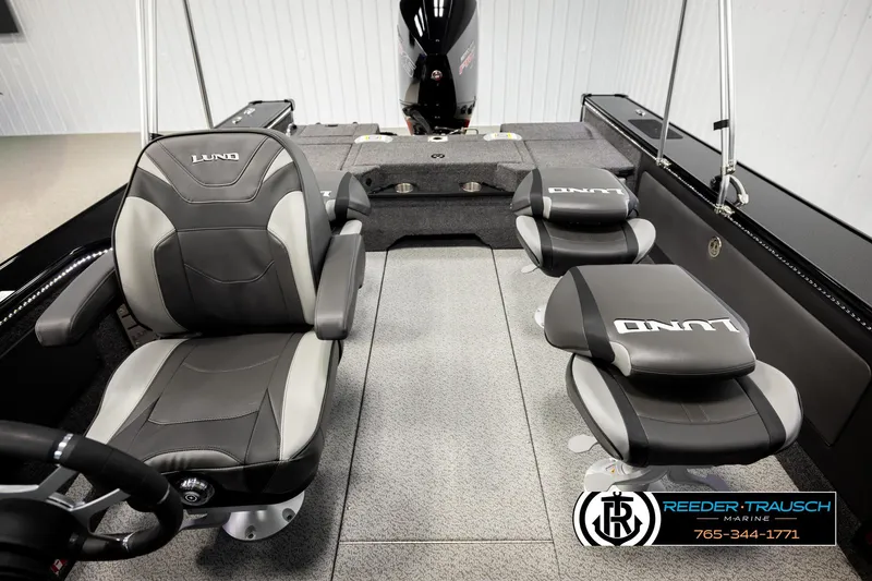 Slide: The Image of 2026 Lund 1975 Pro-V Sport boat interior with premium seating and steering wheel. - 30