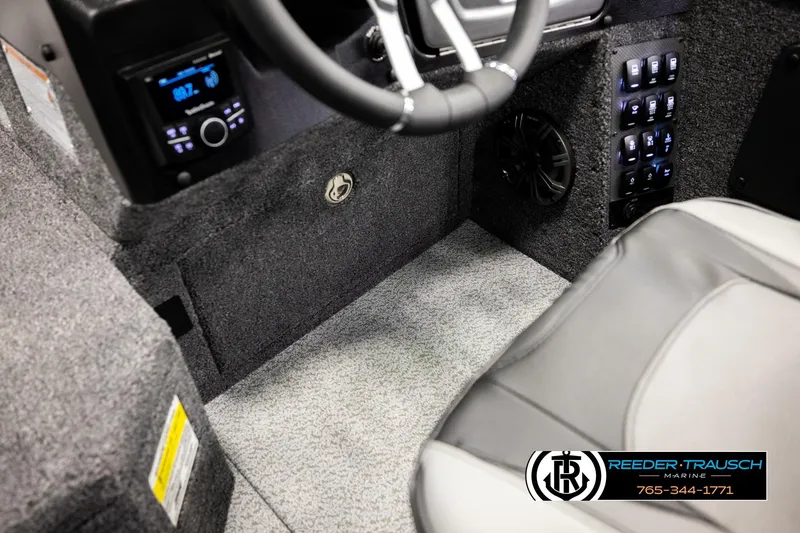 Slide: The Image of Interior of 2026 Lund 1975 Pro-V Sport boat with modern controls and seating. - 34