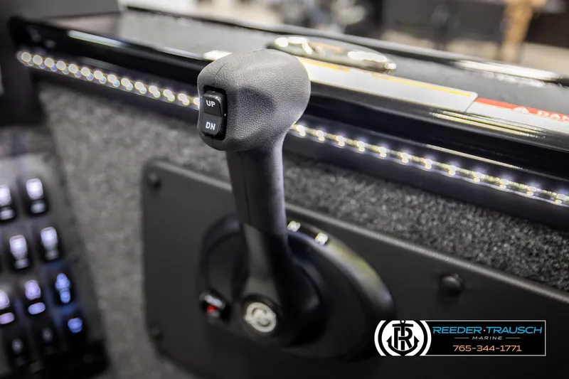 Slide: The Image of Throttle control lever of 2026 Lund 1975 Pro-V Sport boat, featuring "UP" and "DN" buttons. - 44