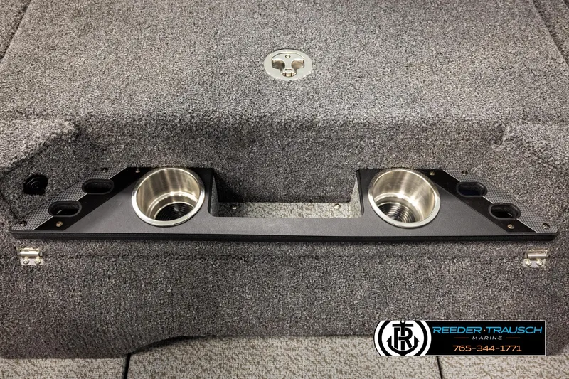 Slide: The Image of Interior of 2026 Lund 1975 Pro-V Sport boat with cup holders and carpeted surface. - 50