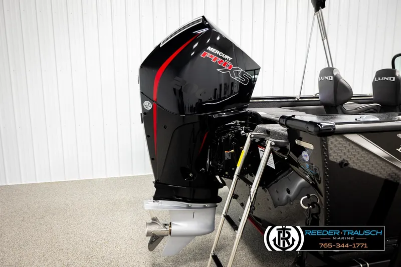 Slide: The Image of 2026 Lund 1975 Pro-V Sport boat with Mercury Pro XS engine in showroom. - 53