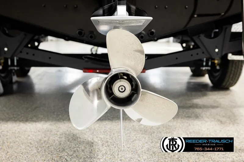Slide: The Image of Close-up of 2026 Lund 1975 Pro-V Sport boat propeller in showroom. - 56