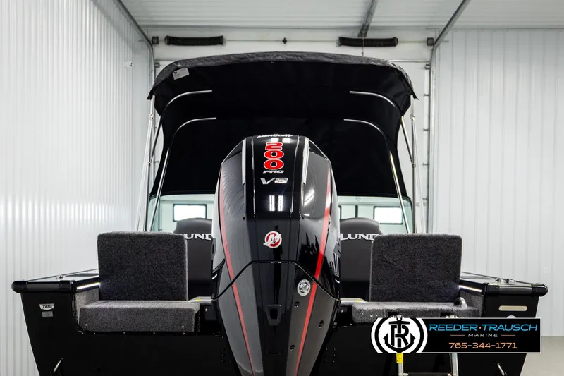 Slide: The Image of 2026 Lund 1975 Pro-V Sport boat with powerful V8 engine in a showroom. - 6