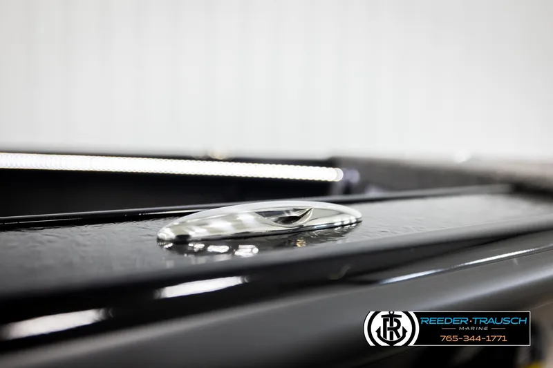 Slide: The Image of Close-up of 2026 Lund 1975 Pro-V Sport boat detail with sleek design and logo. - 64