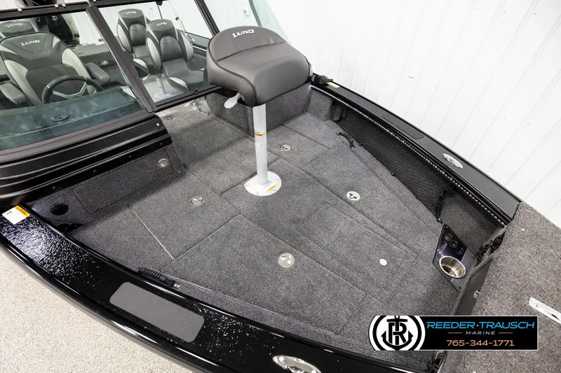 Slide: The Image of 2026 Lund 1975 Pro-V Sport boat interior with seating and storage compartments. - 8