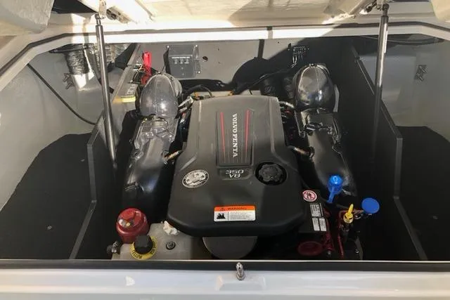 Slide: The Image of Engine compartment of a 2019 Regal LS6 boat featuring a Volvo Penta V8 350 engine. - 8