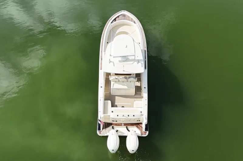 Slide: The Image of 2020 Chris-Craft Catalina 34 boat on calm green water, aerial view. - 13