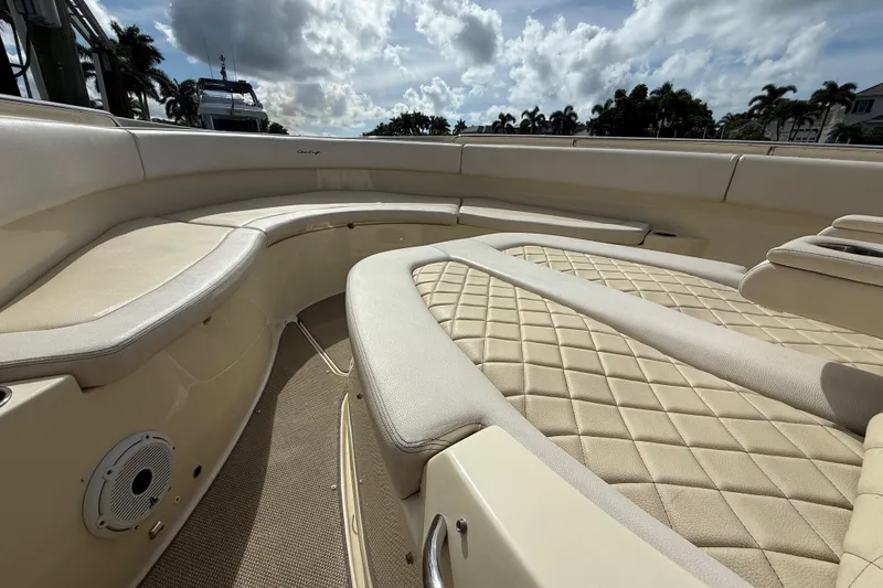 Slide: The Image of Luxurious interior of 2020 Chris-Craft Catalina 34 boat with beige seating and quilted design. - 15