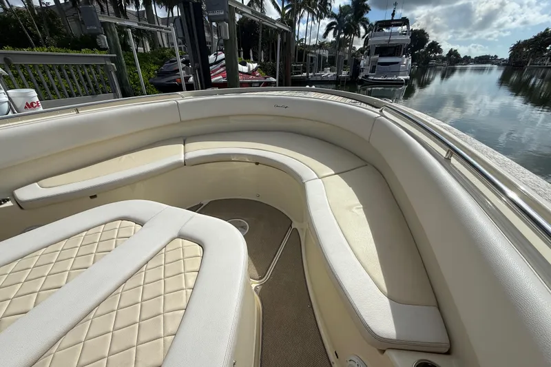 Slide: The Image of 2020 Chris-Craft Catalina 34 boat interior with luxurious seating at a marina. - 18