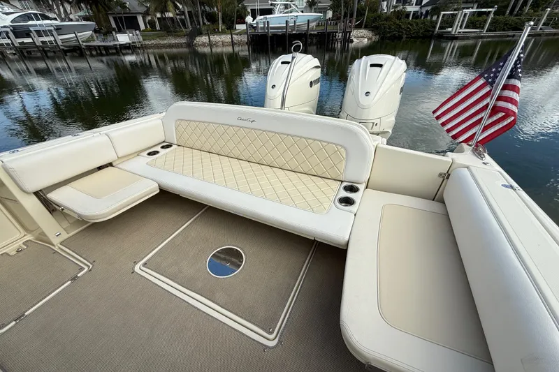Slide: The Image of 2020 Chris-Craft Catalina 34 boat interior with seating and American flag. - 25