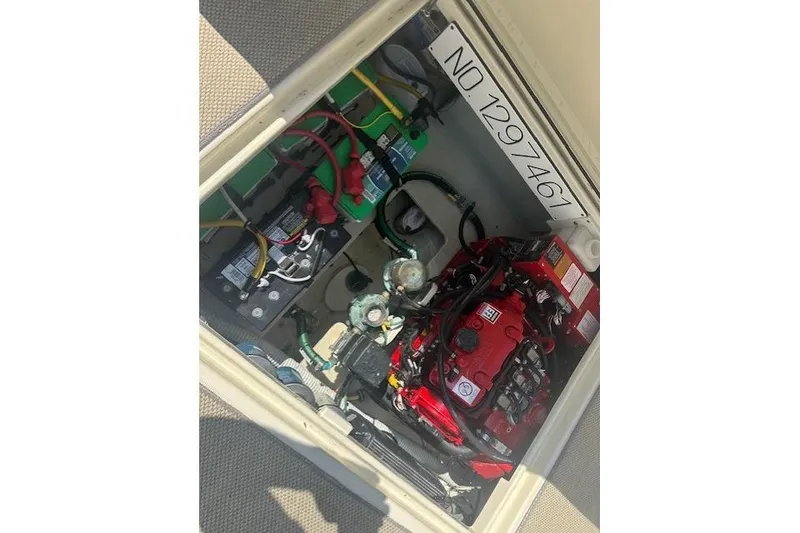 Slide: The Image of Engine compartment of a 2020 Chris-Craft Catalina 34 with visible wiring and components. - 30