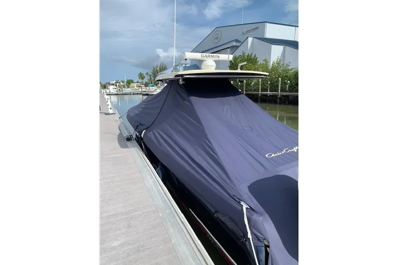 Slide: The Image of 2020 Chris-Craft Catalina 34 covered at dock, featuring Garmin equipment. - 31