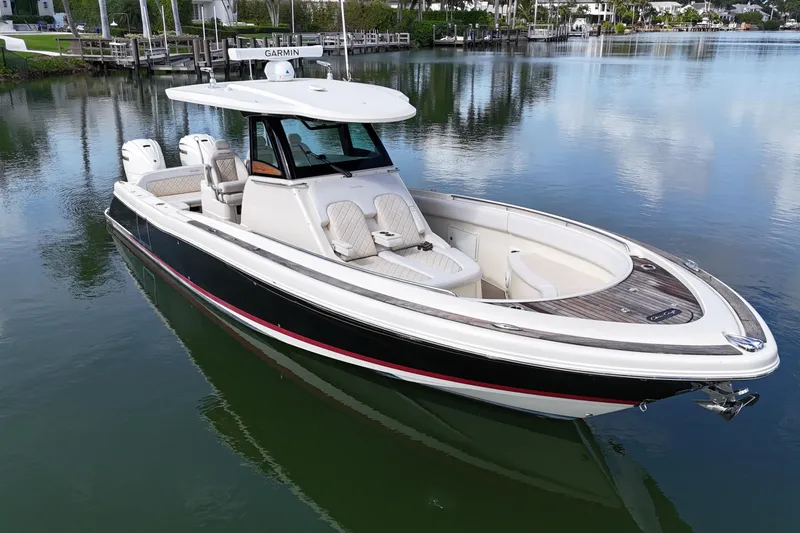 Slide: The Image of 2020 Chris-Craft Catalina 34 boat on calm water, featuring sleek design and luxury seating. - 5